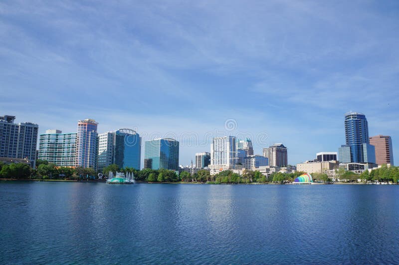 High-rise buildings, skyline and fountain at Lake Eola,Downtown Orlando, Florida in United States, April 27, 2017. High-rise buildings, skyline and fountain at Lake Eola,Downtown Orlando, Florida in United States, April 27, 2017.