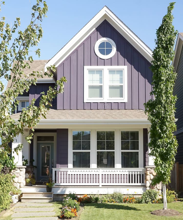 New small two story purple colored house built in Chilliwack British Columbia Canada showing front deck, white picket deck railing and exterior siding details. New small two story purple colored house built in Chilliwack British Columbia Canada showing front deck, white picket deck railing and exterior siding details