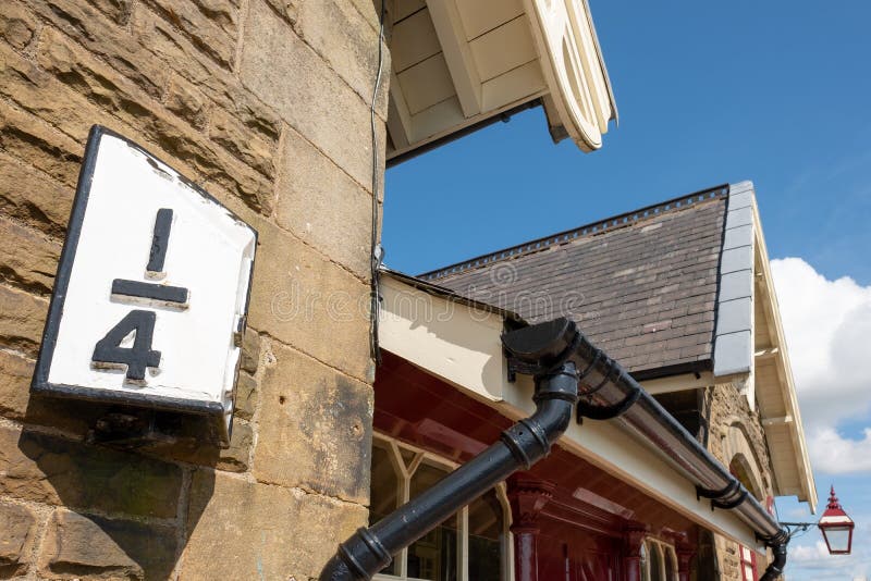 Detailed view of an old-style Railway Station booking office and waiting room set in the North York Dales. The fine stonework is clearly evident. Detailed view of an old-style Railway Station booking office and waiting room set in the North York Dales. The fine stonework is clearly evident.