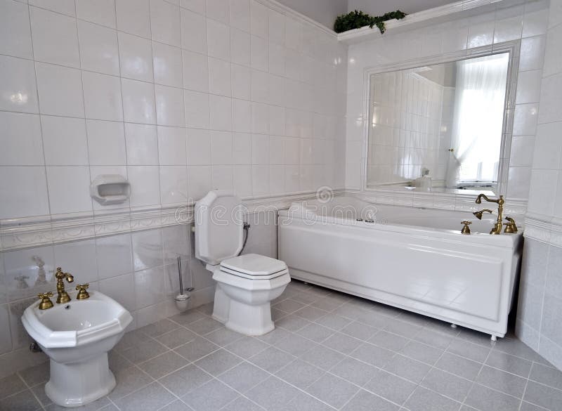 Elegant bathroom, all white color, classic golden faucets. Elegant bathroom, all white color, classic golden faucets.
