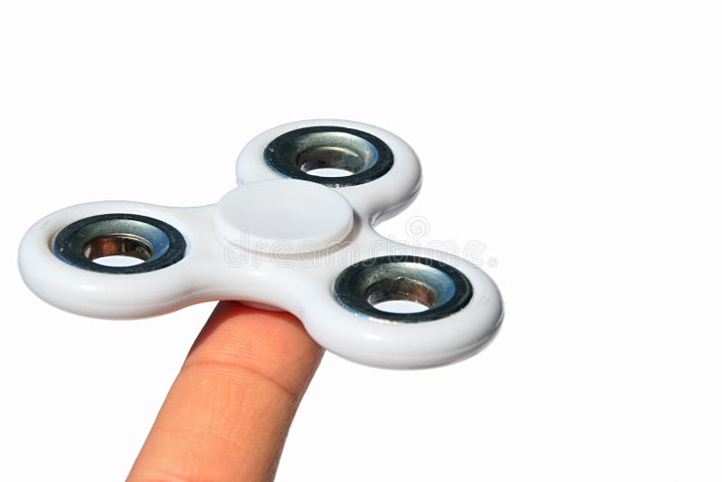 Λευκός fidget κλώστης στο αντίχειρα του ενήλικου αρσενικού προσώπου, άσπρο υπόβαθρο στοκ εικόνες Λευκός fidget κλώστης στο αντίχειρα του ενήλικου αρσενικού προσώπου, άσπρο υπόβαθρο στοκ εικόνες
