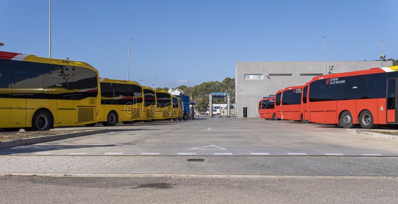 Felanitx, Spain november 05 2023: Buses of the public company TIB, parked in an industrial park in Felanitx, island of Mallorca, Spain. Felanitx, Spain november 05 2023: Buses of the public company TIB, parked in an industrial park in Felanitx, island of Mallorca, Spain