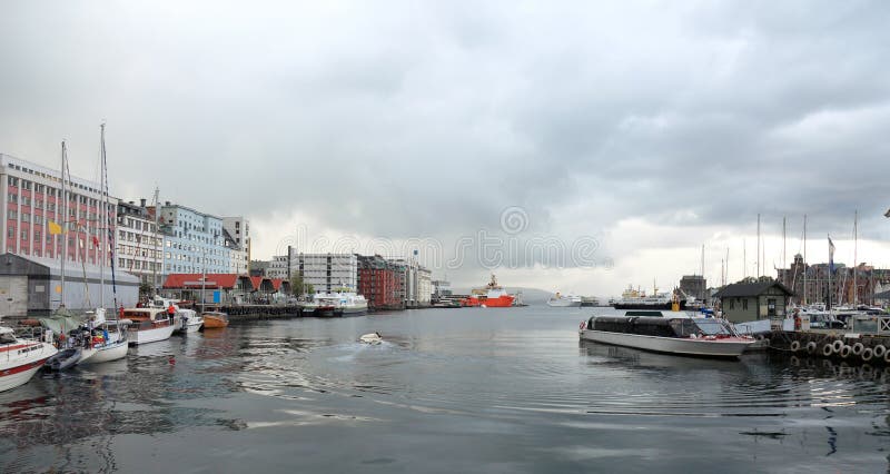 Panoramic view of harbor of Bergen, Norway. Dramatic scandinavian sky in summer. Panoramic view of harbor of Bergen, Norway. Dramatic scandinavian sky in summer.