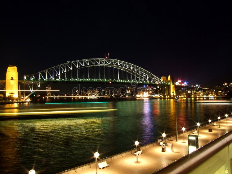 Night shot of Sydney Harbour Bridge with moving ferries. Night shot of Sydney Harbour Bridge with moving ferries