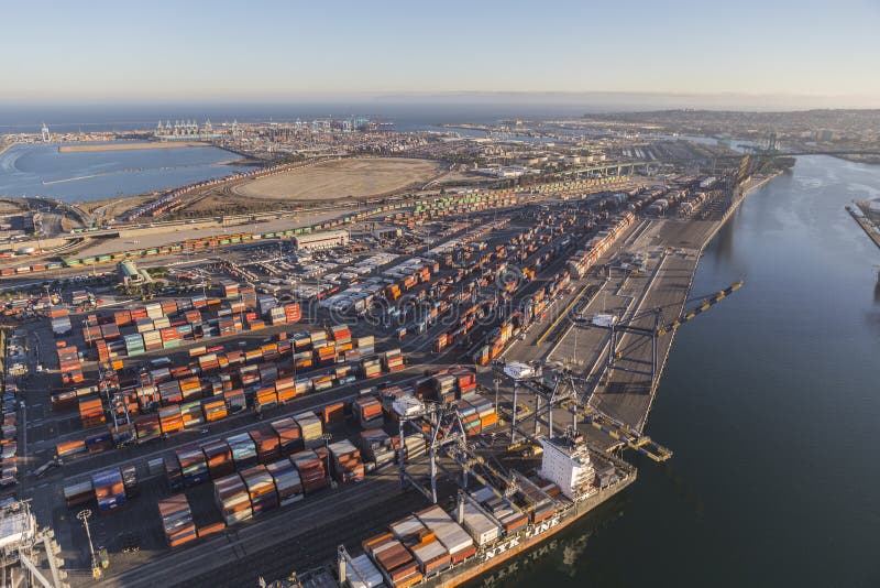 Los Angeles, California, USA - August 16, 2016: Afternoon aerial view of Port of Los Angeles berths, cranes and containers. Los Angeles, California, USA - August 16, 2016: Afternoon aerial view of Port of Los Angeles berths, cranes and containers.