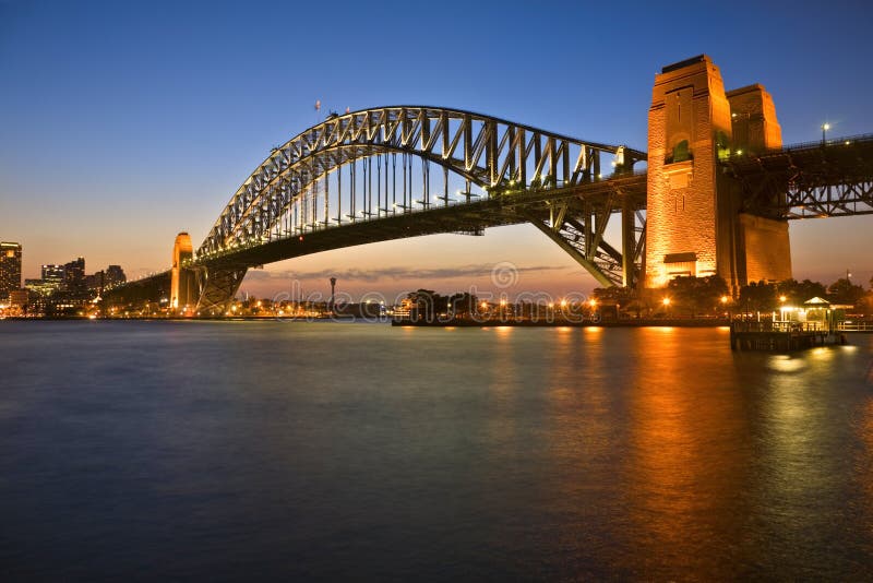 Classic shot of Sydney Harbour Bridge, illuminated at twilight. Classic shot of Sydney Harbour Bridge, illuminated at twilight.