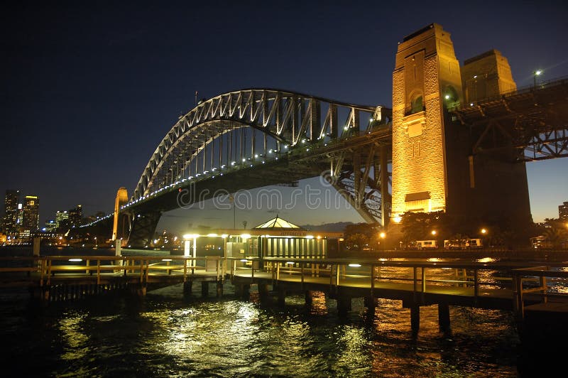 Harbour Bridge in Sydney; night scene; wooden wharf in foreground. Harbour Bridge in Sydney; night scene; wooden wharf in foreground