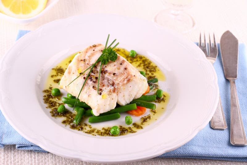 Cod Fillet with green beans, peas, parsley, olive oil and wine. Cod Fillet with green beans, peas, parsley, olive oil and wine
