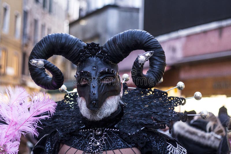 Person in a Satyr Carnival mask in Venice. Person in a Satyr Carnival mask in Venice.