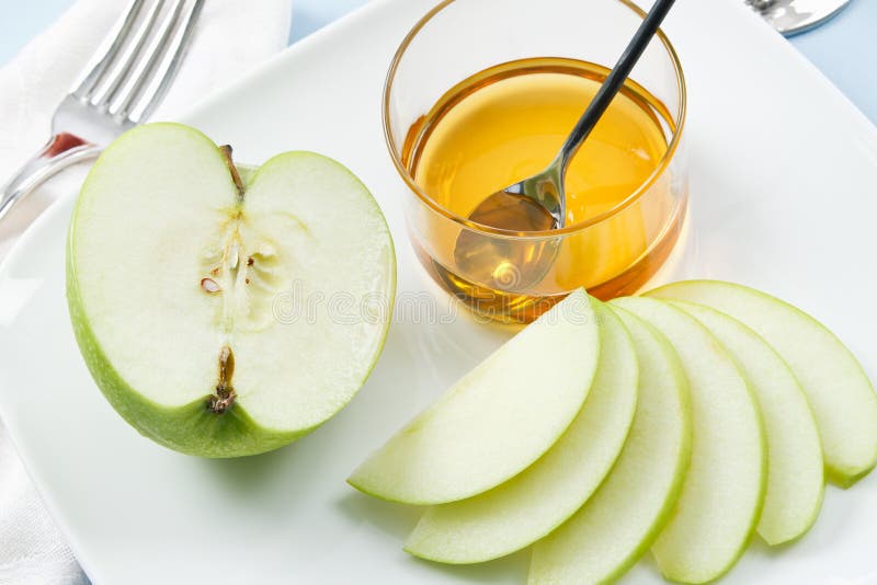 Apples and Honey are traditional symbols shared at Rosh Hashanah celebrations. Apples and Honey are traditional symbols shared at Rosh Hashanah celebrations