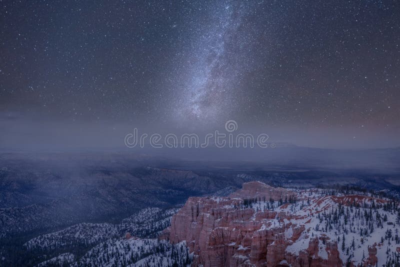 Long exposure photo of Milky Way on Bryce Canyon National Park in a misty and cloudy sky. Long exposure photo of Milky Way on Bryce Canyon National Park in a misty and cloudy sky