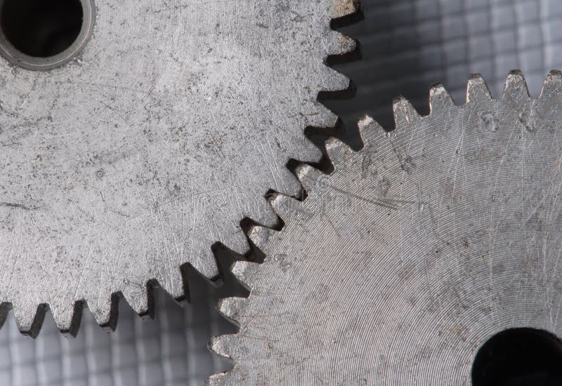 Macro detail of old gears. With extra highlight to show the great old surface structure. Macro detail of old gears. With extra highlight to show the great old surface structure.