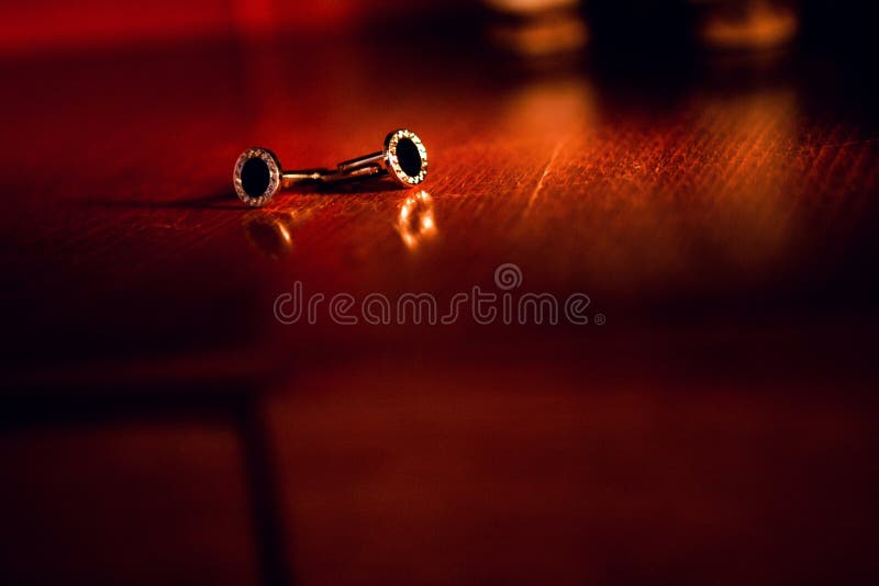 Cufflinks on the red table. Cufflinks on the red table