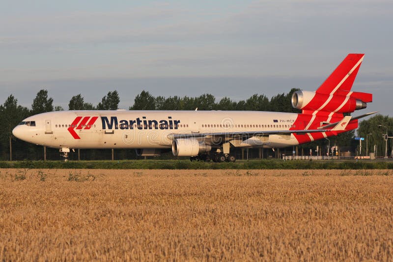 Dutch Martinair McDonnell Douglas MD-11 with registration PH-MCP rolling on taxiway V of Amsterdam Airport Schiphol. Dutch Martinair McDonnell Douglas MD-11 with registration PH-MCP rolling on taxiway V of Amsterdam Airport Schiphol