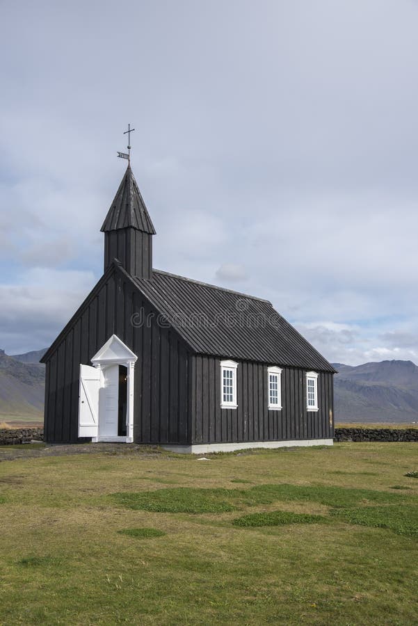 The BuÃ°ir black church is one of 3 black churches in Iceland. They are black because the exterior wood is painted with pitch, just like the hull of a boat. This is to protect it from the harsh Icelandic elements. This works fairly well and buildings treated in this way have survived over 100 years. The church here is special. There has been a church here since 1703. When the importance of BuÃ°ir as a trading post declined, the hamlet was declared to no longer be a parish. A replacement church was needed, but not forthcoming from the church. One woman fought and won the Kingâ€™s permission to build a new churchâ€¦ Steinunn LÃ¡rusdÃ³ttir. When her church was completed in 1848, a plaque claimed the BuÃ°ir black church was build without the help of the â€œFathersâ€, in other words, without any help from the Lutheran Church. The church which stands there now is a reconstruction of Steinunn LÃ¡rusdÃ³ttirâ€™s church. And it serves as a reminder of the strong Icelandic woman and her determination. The BuÃ°ir black church is one of 3 black churches in Iceland. They are black because the exterior wood is painted with pitch, just like the hull of a boat. This is to protect it from the harsh Icelandic elements. This works fairly well and buildings treated in this way have survived over 100 years. The church here is special. There has been a church here since 1703. When the importance of BuÃ°ir as a trading post declined, the hamlet was declared to no longer be a parish. A replacement church was needed, but not forthcoming from the church. One woman fought and won the Kingâ€™s permission to build a new churchâ€¦ Steinunn LÃ¡rusdÃ³ttir. When her church was completed in 1848, a plaque claimed the BuÃ°ir black church was build without the help of the â€œFathersâ€, in other words, without any help from the Lutheran Church. The church which stands there now is a reconstruction of Steinunn LÃ¡rusdÃ³ttirâ€™s church. And it serves as a reminder of the strong Icelandic woman and her determination.