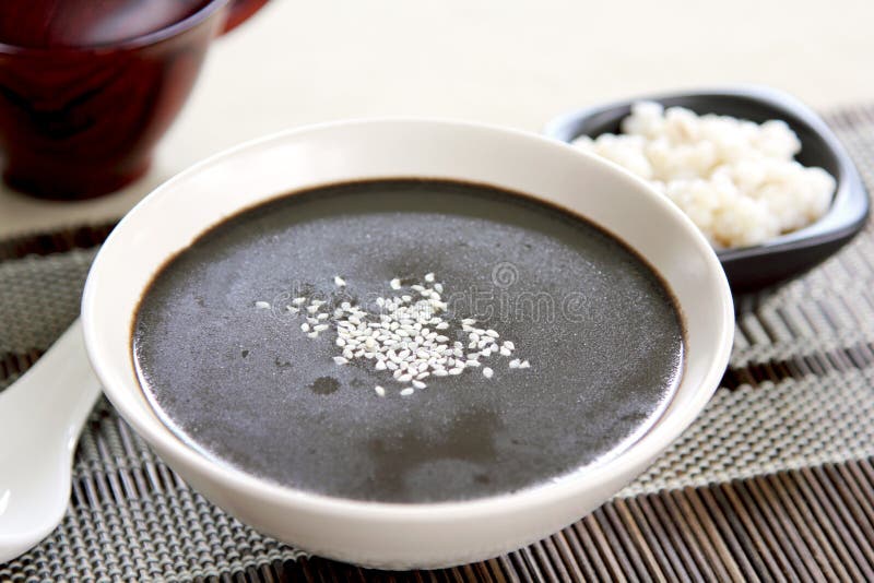 Black sesame with pearl-barley soup in a japanese bowl. Black sesame with pearl-barley soup in a japanese bowl