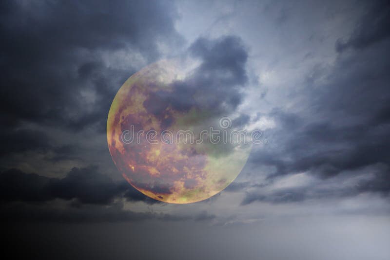 Big full colourful yellow red moon in dark blue cloudy sky over some clouds. Moon covered with clouds. Moon, sky, planets, nature, night, twilight, mystery, science, nebula. Suitable for wallpaper, book cover or illustration. Universe wallpaper. Space for text. Global warming, air pollution, climate change. Big full colourful yellow red moon in dark blue cloudy sky over some clouds. Moon covered with clouds. Moon, sky, planets, nature, night, twilight, mystery, science, nebula. Suitable for wallpaper, book cover or illustration. Universe wallpaper. Space for text. Global warming, air pollution, climate change.