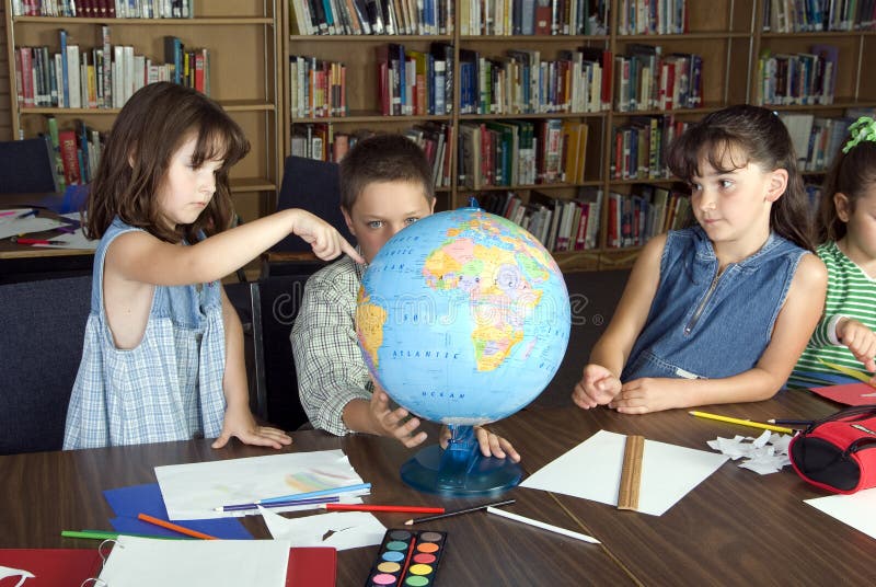 Elementary school students studying in library. Elementary school students studying in library