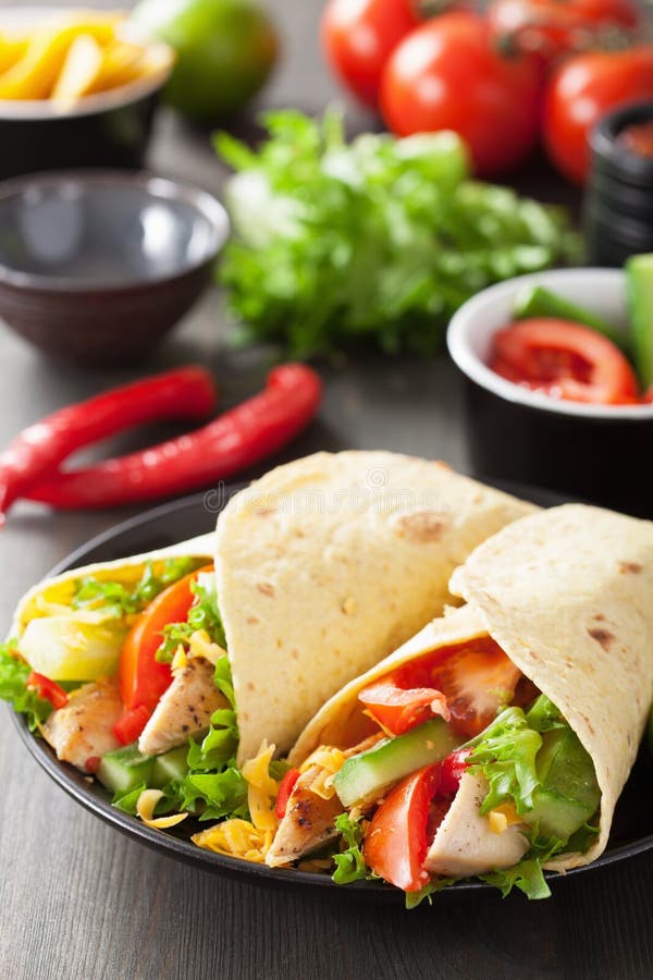 Mexican tortilla wraps with chicken breast and vegetables. Mexican tortilla wraps with chicken breast and vegetables