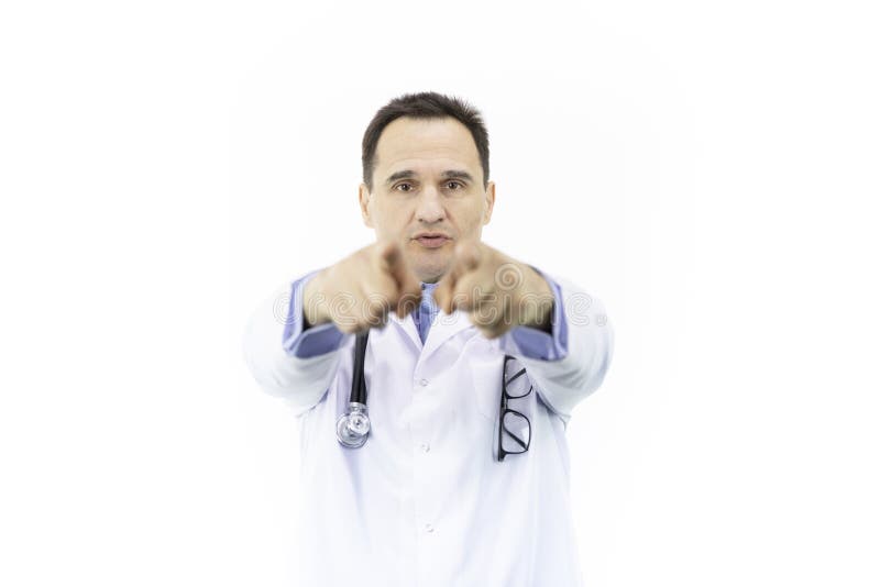 Middle-aged handsome doctor in white coat and stethoscope pointing with finger in front of himself to camera and to you. Middle-aged handsome doctor in white coat and stethoscope pointing with finger in front of himself to camera and to you