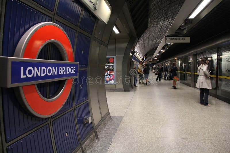 LONDON - MAY 13: Travelers wait at London Bridge underground station on May 13, 2012 in London. London Underground is the 11th busiest metro system worldwide with 1.1 billion annual rides. LONDON - MAY 13: Travelers wait at London Bridge underground station on May 13, 2012 in London. London Underground is the 11th busiest metro system worldwide with 1.1 billion annual rides.