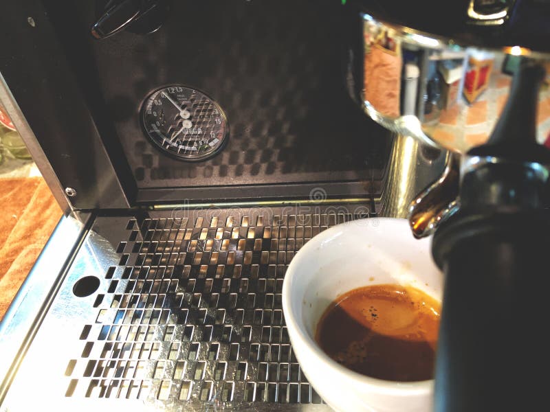 Coffee machine, Espresso shot drop on white cup , Fresh coffee in cafe , morning coffee and morning sunlight , coffee lover, vintage style. Coffee machine, Espresso shot drop on white cup , Fresh coffee in cafe , morning coffee and morning sunlight , coffee lover, vintage style