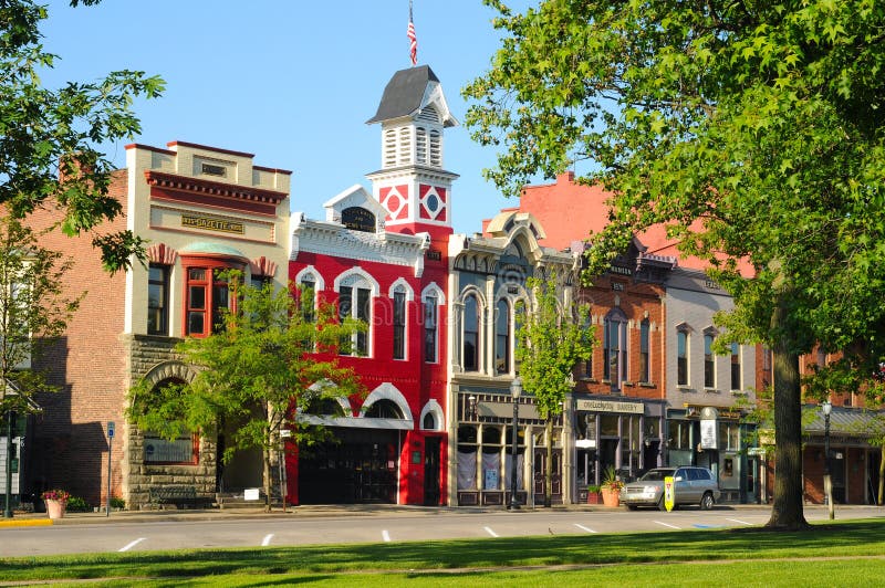 MEDINA, OH - MAY 19, 2012: East Washington Street in Medina, Ohio, features a historic town hall and firehouse (bright red building) more than 130 years old. MEDINA, OH - MAY 19, 2012: East Washington Street in Medina, Ohio, features a historic town hall and firehouse (bright red building) more than 130 years old.