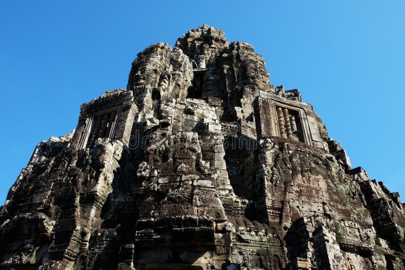 Monumental ancient temple of Bayon in Cambodia. Medieval temple in Indochina. Architectural art of ancient civilizations. Monumental ancient temple of Bayon in Cambodia. Medieval temple in Indochina. Architectural art of ancient civilizations.