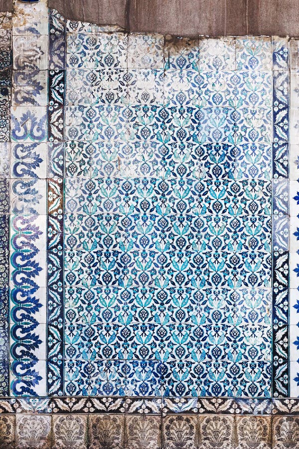 Seamless pattern white Turkish tiles with blue ornaments. Old surface texture, wall in mosque. Seamless pattern white Turkish tiles with blue ornaments. Old surface texture, wall in mosque