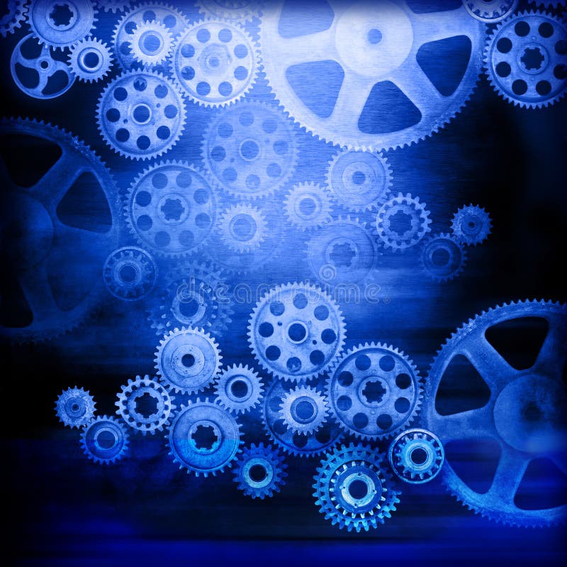 A montage of connected industrial cogs or gears with a blue tone and metallic texture. A montage of connected industrial cogs or gears with a blue tone and metallic texture.