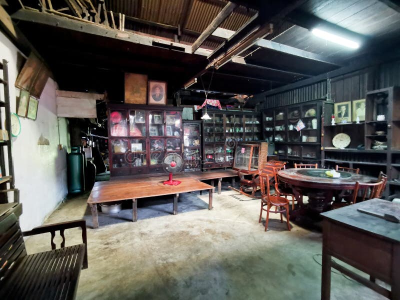 BANGKOK, THAILAND - OCTOBER 30, 2022: Old traditional villager home wooden buiilding in the local market with wooden furnitures during daytime. BANGKOK, THAILAND - OCTOBER 30, 2022: Old traditional villager home wooden buiilding in the local market with wooden furnitures during daytime.