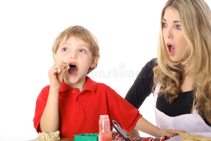 Oh NO child tasting cookie batter isolated on white. Oh NO child tasting cookie batter isolated on white