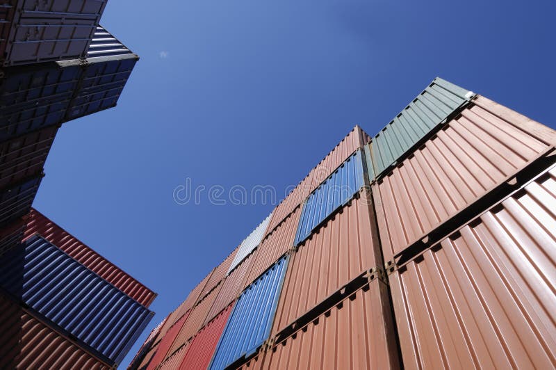 Stacks of containers for shipping against blue sky. Stacks of containers for shipping against blue sky