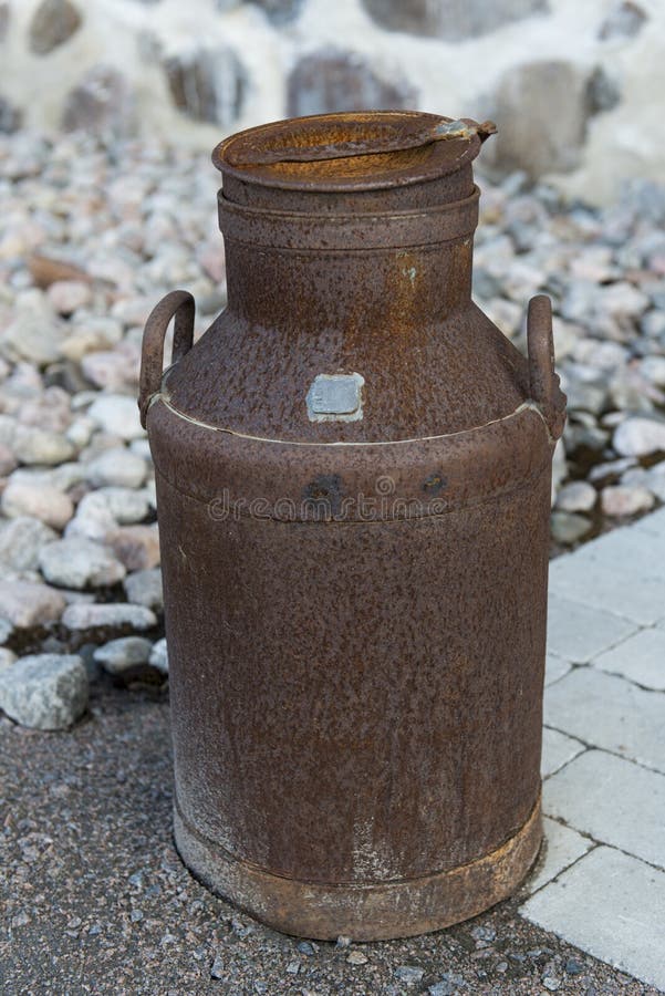 A very old and rusty milk bottle. A very old and rusty milk bottle.