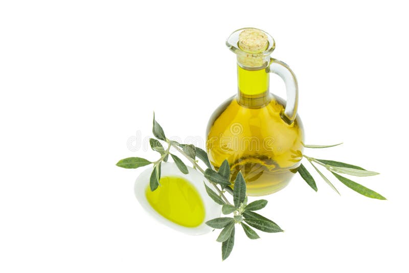 Μπουκάλι ελαιολάδου και πιάτο κύπελλων με το κλαδί ελιάς Ελαιόλαδο της Virgin Φυσικό ελαιόλαδο, υγιή τρόφιμα στοκ εικόνες με δικαίωμα ελεύθερης χρήσης