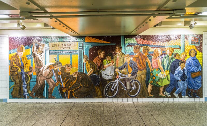 NEW YORK, USA - OCT 22 2015: mosaic made of tiles at the wall in station times square in New York. With 1.75 billion annual ridership, NYC Subway is the 7th busiest metro system in the world. NEW YORK, USA - OCT 22 2015: mosaic made of tiles at the wall in station times square in New York. With 1.75 billion annual ridership, NYC Subway is the 7th busiest metro system in the world.