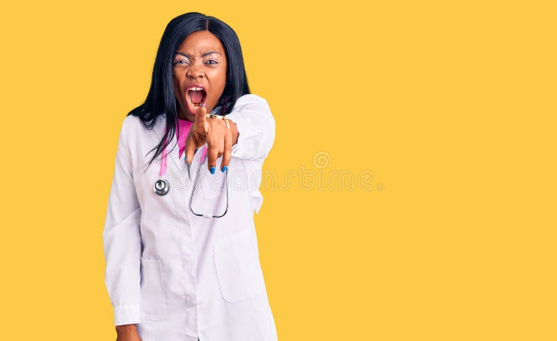 Young african american woman wearing doctor stethoscope pointing displeased and frustrated to the camera, angry and furious with you. Young african american woman wearing doctor stethoscope pointing displeased and frustrated to the camera, angry and furious with you