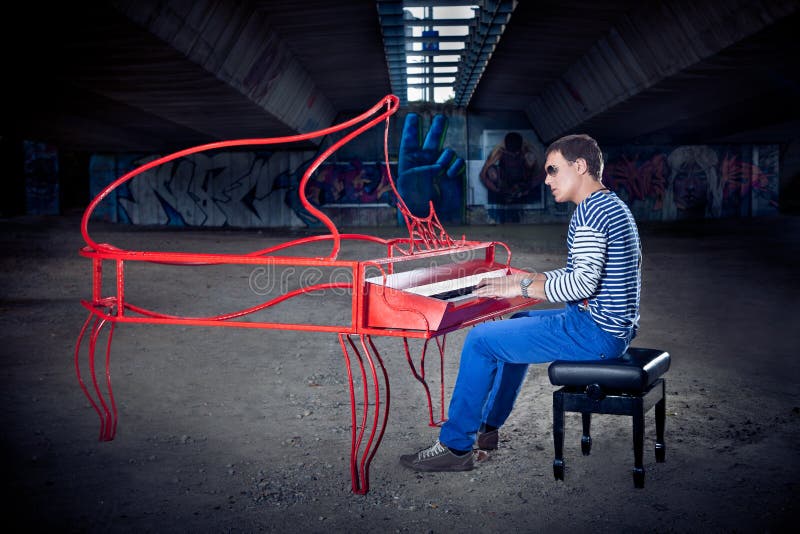 Young pianist play on his piano with bright emotions, Novi Sad, Serbia. Young pianist play on his piano with bright emotions, Novi Sad, Serbia.