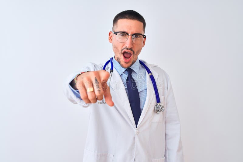 Young doctor man wearing stethoscope over isolated background pointing displeased and frustrated to the camera, angry and furious with you. Young doctor man wearing stethoscope over isolated background pointing displeased and frustrated to the camera, angry and furious with you