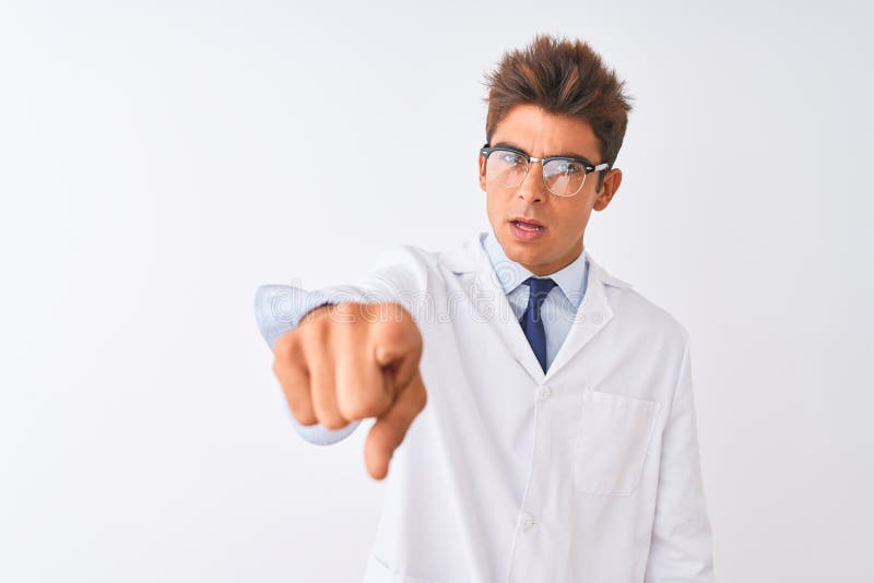 Young handsome sciencist man wearing glasses and coat over isolated white background pointing displeased and frustrated to the camera, angry and furious with you. Young handsome sciencist man wearing glasses and coat over isolated white background pointing displeased and frustrated to the camera, angry and furious with you