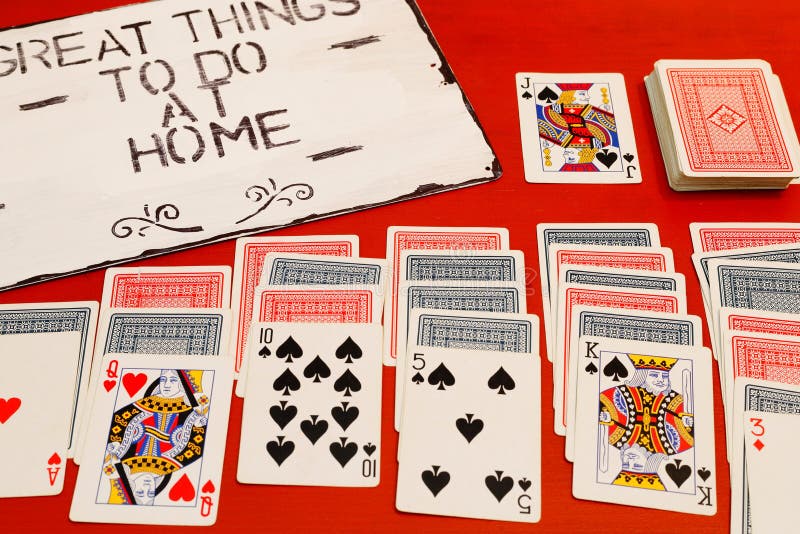 Great things to do at home solitaire game on red background. Great things to do at home solitaire game on red background