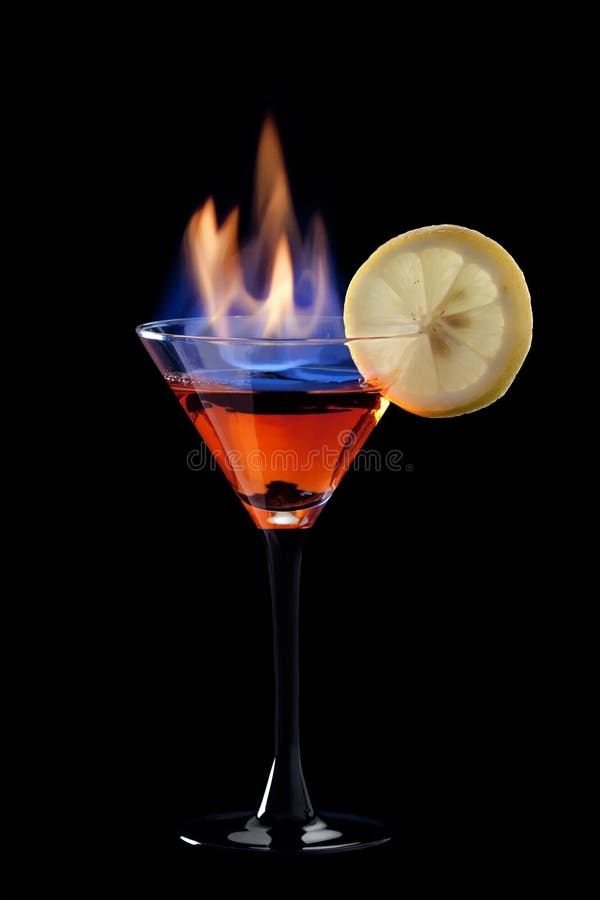 A Flaming cocktail over black. A Flaming cocktail over black