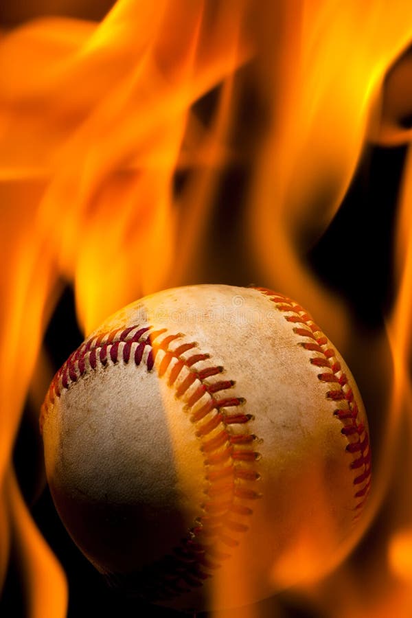 A weathered baseball engulfed in flames. A weathered baseball engulfed in flames