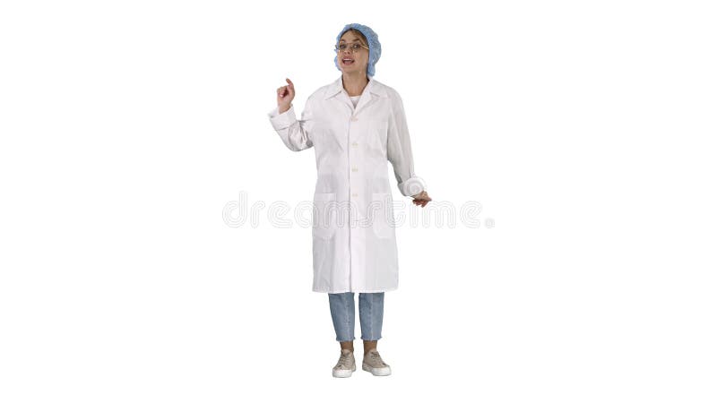 Full length shot. Young doctor woman talking to camera in very emotional way on white background. Professional shot in 4K resolution. 006. You can use it e.g. in your commercial video, business, presentation, broadcast. Full length shot. Young doctor woman talking to camera in very emotional way on white background. Professional shot in 4K resolution. 006. You can use it e.g. in your commercial video, business, presentation, broadcast