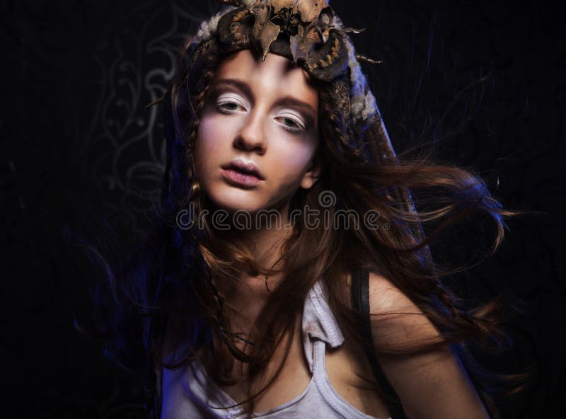 Young woman with creative make up. Halloween theme. Young woman with creative make up. Halloween theme.