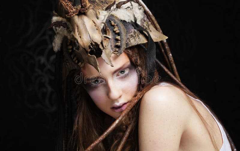 Young woman with creative make up. Halloween theme. Close up. Young woman with creative make up. Halloween theme. Close up.