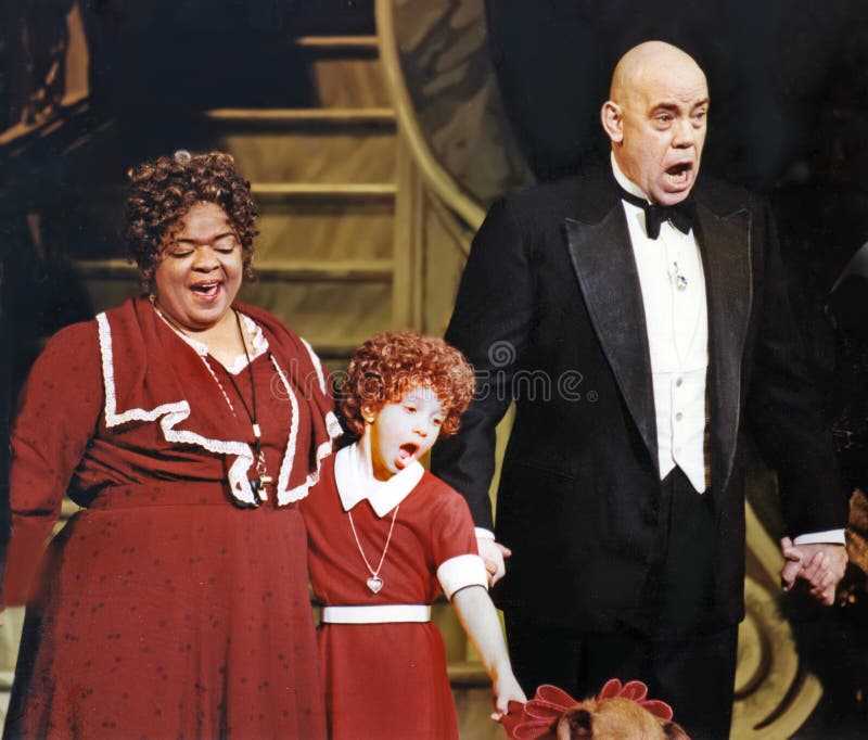 Nell Carter, Brittny Kissinger, and John Schuck take their bows at the conclusion of a performance of a revival of `Annie,` at the Martin Beck Theatre in Manhattan on June 1, 1997. Carter, a noted tv actress, played the role of `Miss Hannigan,` Kissinger played `Annie,` and Schuck, whose full name is Conrad John Schuck, Jr., played the role of `Oliver ``Daddy`` Warbucks.` Schuck has appeared in numerous tv roles dating back to `Gunsmoke` in 1955 when he was 15.  Nell Carter died on January 23, 2003, in Beverly Hills, California, at the age of 54. Nell Carter, Brittny Kissinger, and John Schuck take their bows at the conclusion of a performance of a revival of `Annie,` at the Martin Beck Theatre in Manhattan on June 1, 1997. Carter, a noted tv actress, played the role of `Miss Hannigan,` Kissinger played `Annie,` and Schuck, whose full name is Conrad John Schuck, Jr., played the role of `Oliver ``Daddy`` Warbucks.` Schuck has appeared in numerous tv roles dating back to `Gunsmoke` in 1955 when he was 15.  Nell Carter died on January 23, 2003, in Beverly Hills, California, at the age of 54.