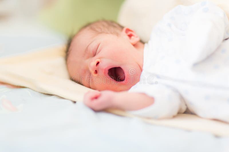 Newborn baby sleeping, 3 days old at home, soft focus,shallow DOF. Newborn baby sleeping, 3 days old at home, soft focus,shallow DOF