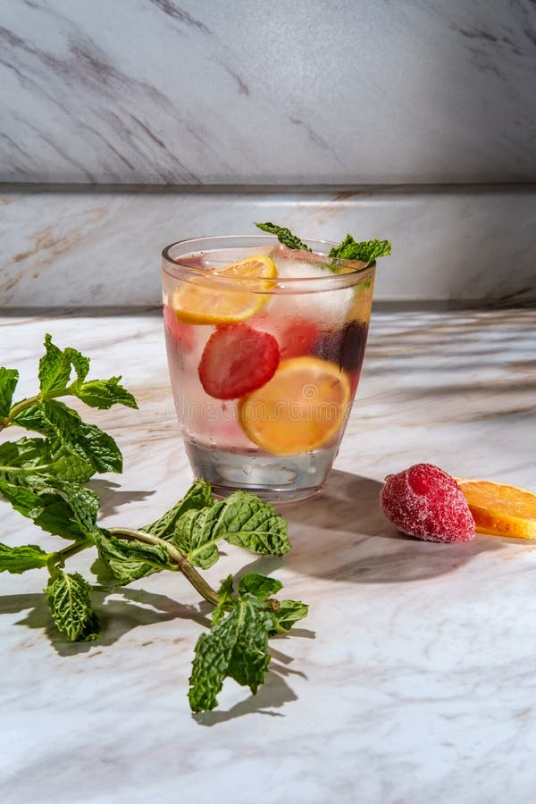 Strawberry lemon and cherry infused fruit water with mint. Strawberry lemon and cherry infused fruit water with mint