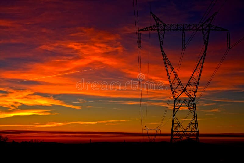 Beautiful view with one electricity tower on dramatic colorful sky at evening time, cloudy sky at orange sunset. Beautiful view with one electricity tower on dramatic colorful sky at evening time, cloudy sky at orange sunset